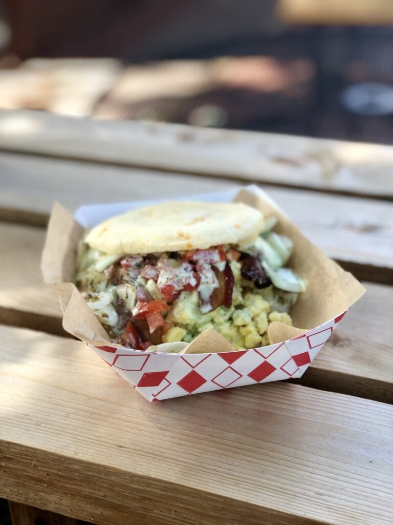 photo of an arepa filled with breakfast foods from the south pearl farmers market in Denver CO