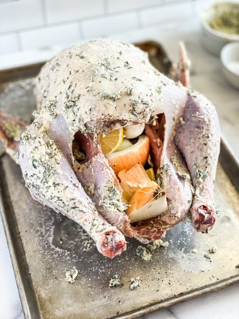 turkey with compound butter slathered all over, and stuffed with onions, lemons and garlic.