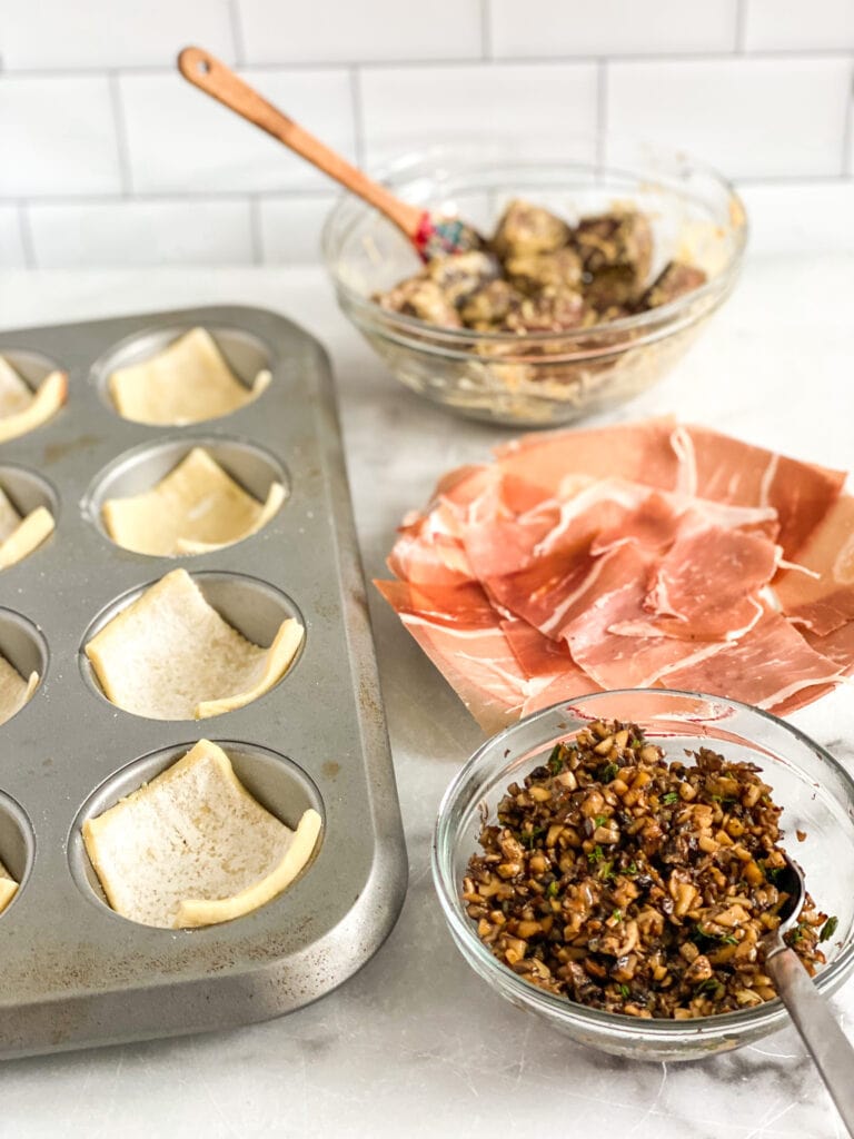 prepared components to the wellington bites, muffin pan with puff pastry, prosciutto, meat & mushroom mix