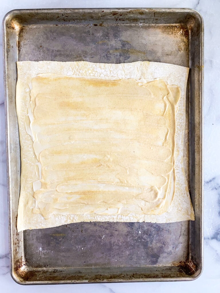bottom of puff pastry sheet, rolled out and topped with a layer of mayo and mustard
